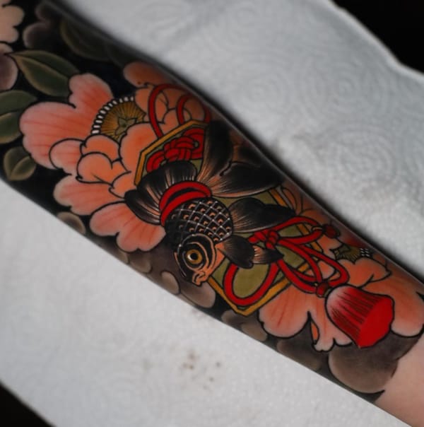 Traditional Floral Tattoo Covering Half of a Sleeve