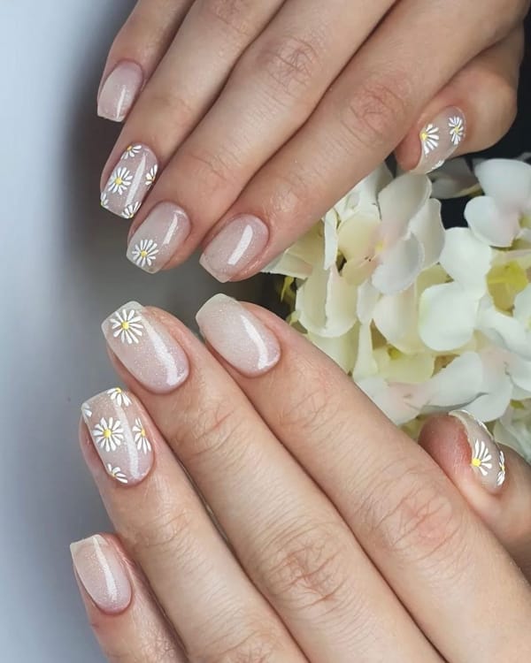 White Pearlescent Manicure with Daisy Motif