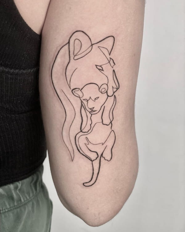 Abstract Mother and Child Lion Tattoo Above an Elbow